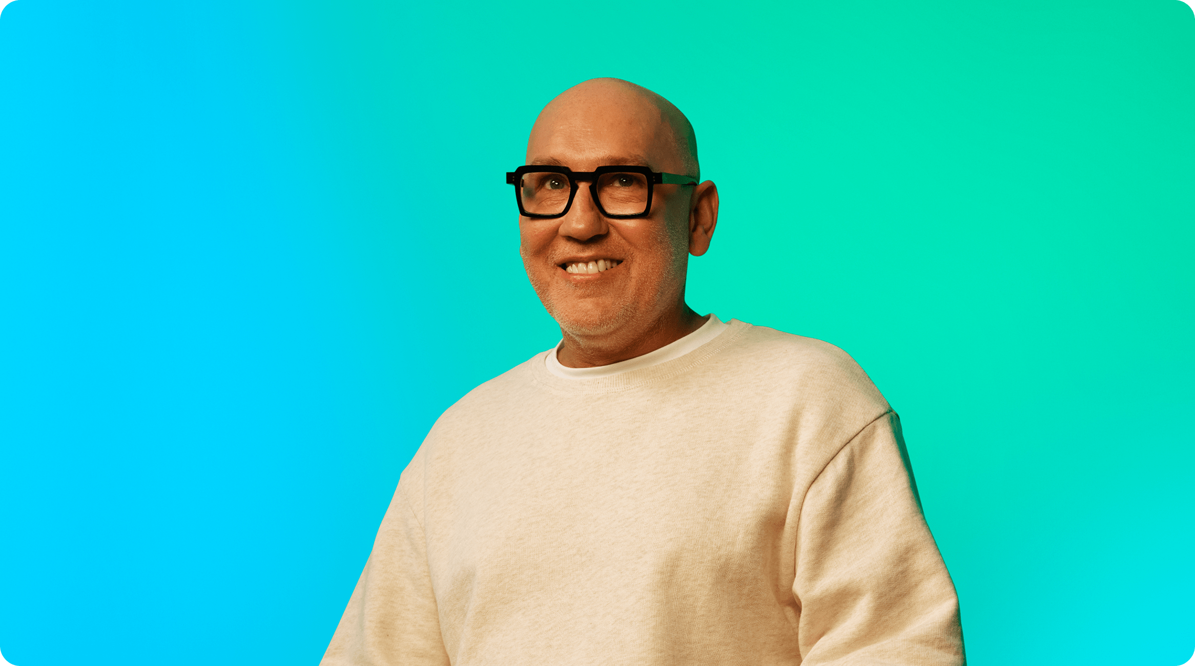 Man with glasses smiling