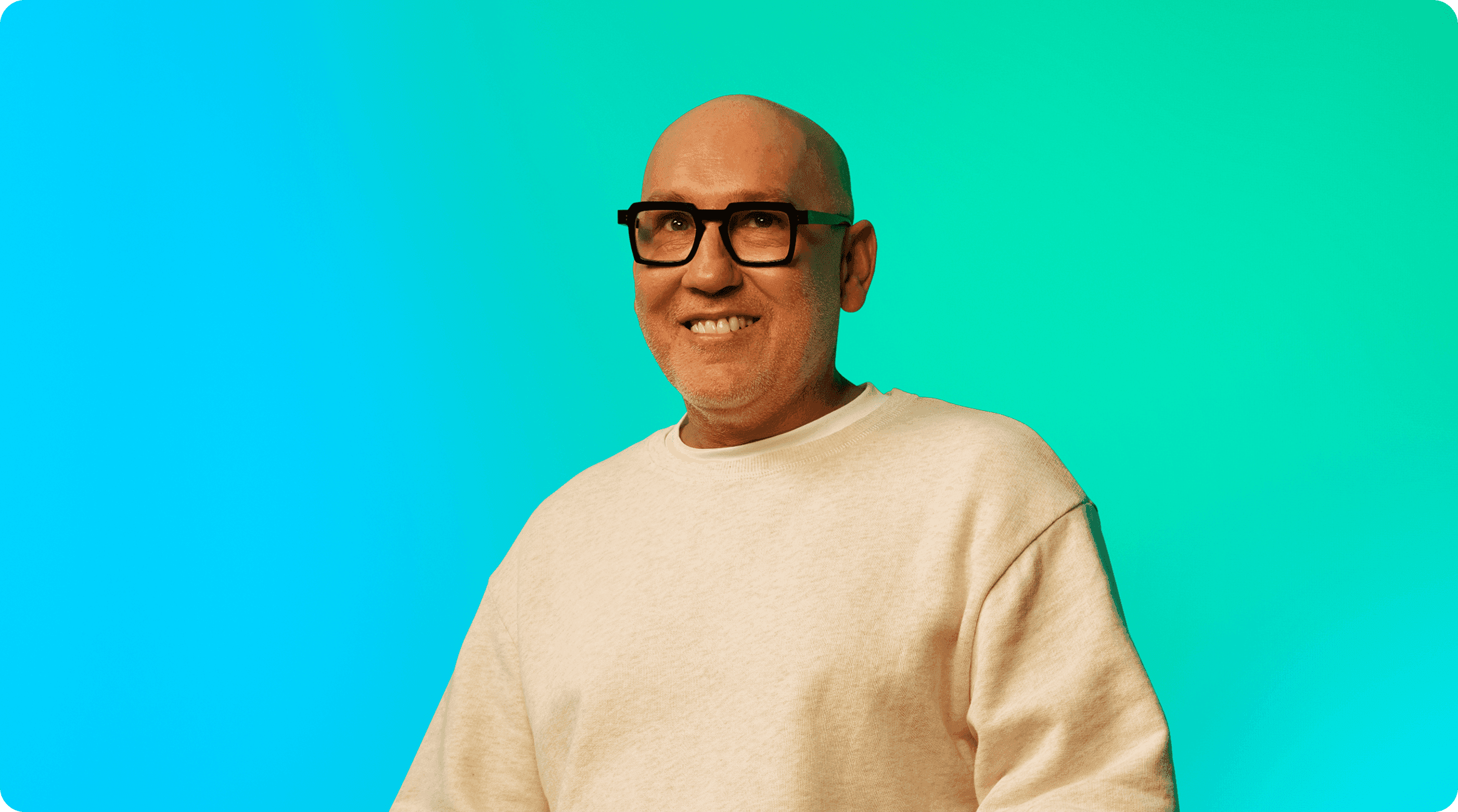 Man with glasses smiling