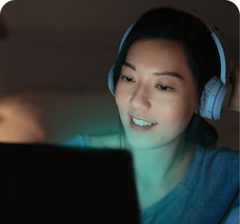Person smiling at computer
