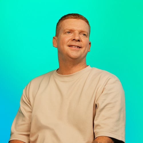 Sam, a man smiling